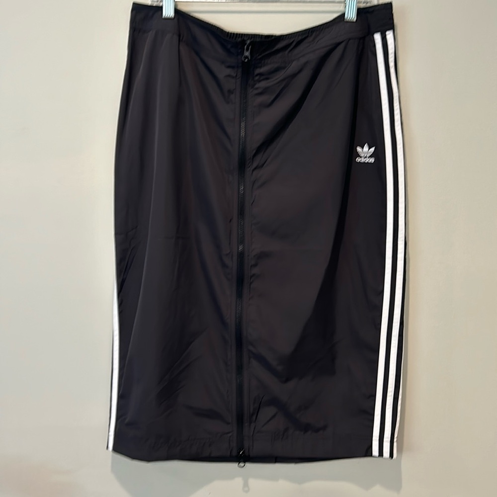 Addidas athletic skirt in black with white stripes